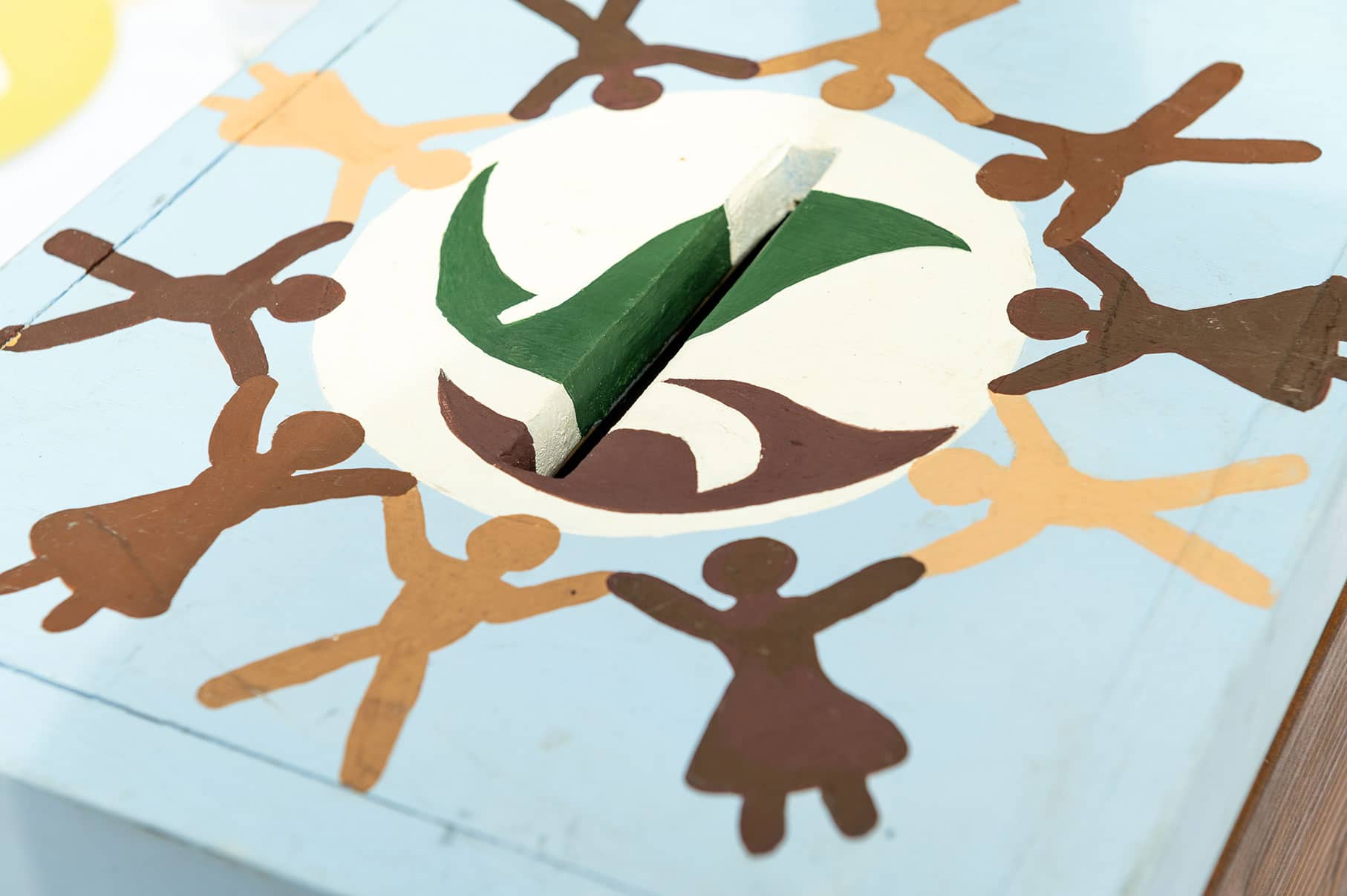 Top of a hand painted ballot box.