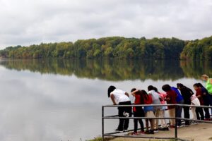 Kids on dock looking out over lake.